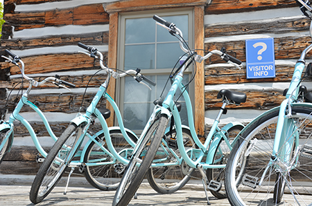 Image of blue cruiser bikes in front of building